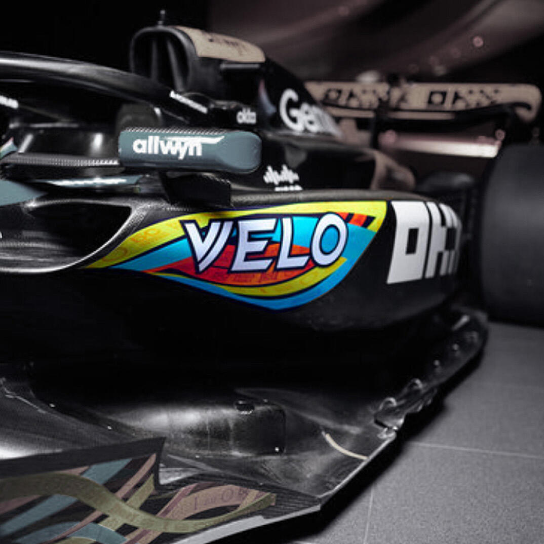Formula 1 racing car with prominent VELO logo on the side.